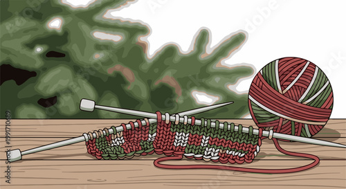 A ball of yarn and knitting needles with partially knitted fabric rests on a wooden surface, with a blurred evergreen tree in the background