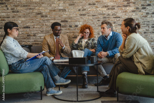 Diverse people participating in group therapy discussion session