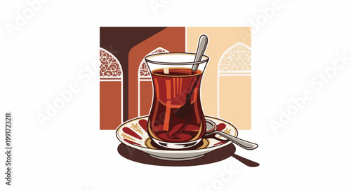 Traditional hot beverage served in an ornate glass with spoons