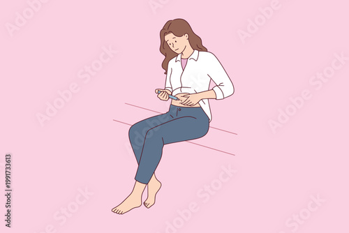 Female patient giving herself an insulin shot or IVF hormone injection in abdomen. Concept of diabetes management, health self-care, or infertility treatment.