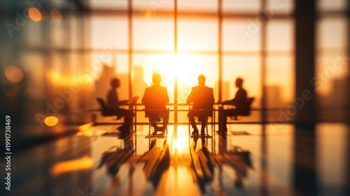 Business people meeting in an office during sunset