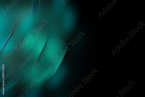An abstract, dark, and fluid motion blur of glowing teal light curves.