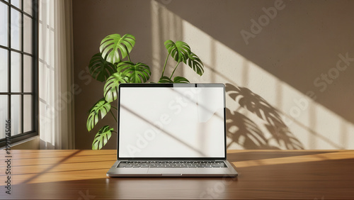 Modern laptop with blank screen on wooden table in sunny home office. Concept of productivity and remote work