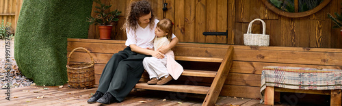 Fotografie Joyful moments shared between a mother and daughter at a charming amusement park