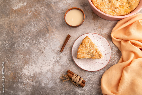 Apple Charlotte cake on brown concrete, top view, flat lay, copy space