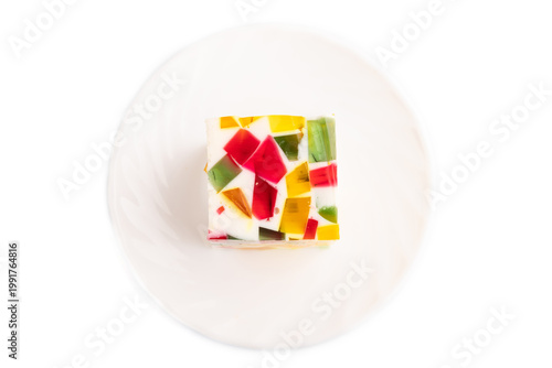 Colored Fruit and milk jelly Isolated on white, top view, close up