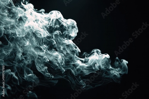 Abstract smoke wisps on black background, ethereal effect