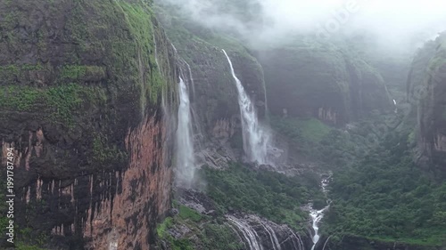 Moving Drone shot of a Huge explosive waterfall shot during heavy monsoon. Three tier waterfall. Tallest waterfall in India. Drone clip 4K60