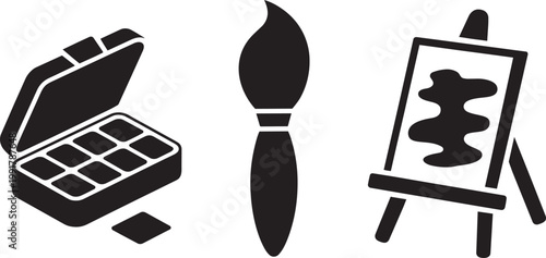 Art supplies icon set featuring a paint palette, brush, and easel with canvas with black and white