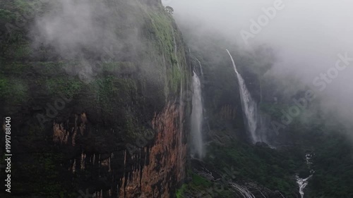Moving Drone shot of a Huge explosive waterfall shot during heavy monsoon. Three tier waterfall. Tallest waterfall in India. Drone clip 4K60