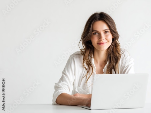young woman working on laptop in bright modern room