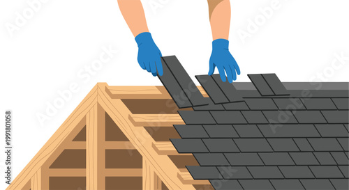 Skilled hands wearing blue protective gloves carefully align dark charcoal shingles onto a light brown wooden gabled roof frame during a home construction project.