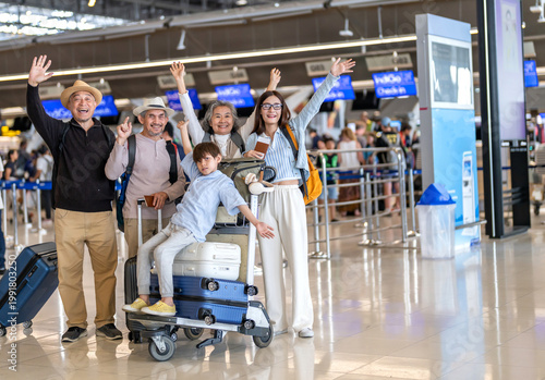 Asian multigenerational family at airport traveling with kids and grandparents, joyful moments of vacation, family holiday trip with luggage before flight, tour, friendly airline, hotel for families