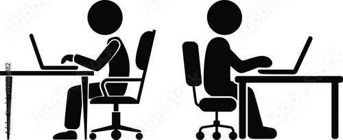 Two individuals working on laptops at separate desks in an office setting