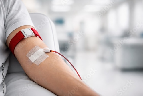 Close-up of a person donating blood in a medical facility, saving lives