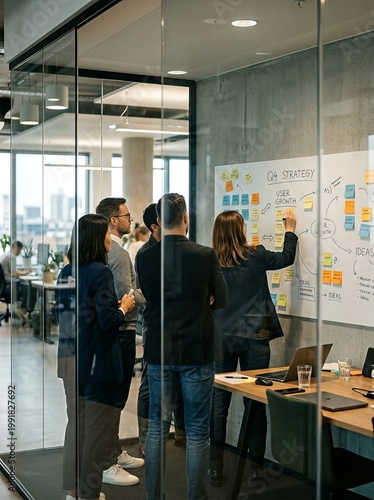 A diverse business team in a modern office environment brainstorming ideas during a strategic planning meeting.