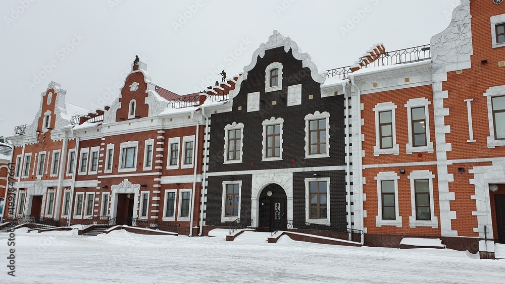Obraz premium Brugge Embankment in Yoshkar-Ola with flemish style architecture in winter, Russia
