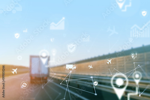Fotografie Logistics truck on highway with digital tracking graphics in motion at sunset