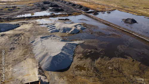 Aerial View of Industrial Storage Yard with Gravel and Coal Piles
