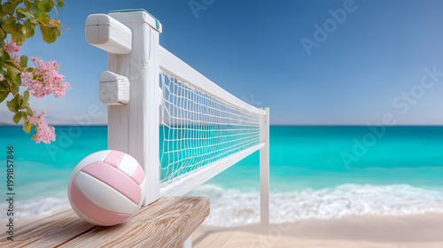 Beach volleyball net with pink ball on sandy shore, turquoise ocean waves and clear blue sky in the background, tropical setting. Selective focus