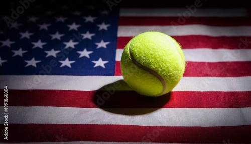 light shining on tennis ball on usa flag; free space for text