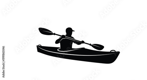 Silhouette of a kayaker paddling on the water in a sleek boat