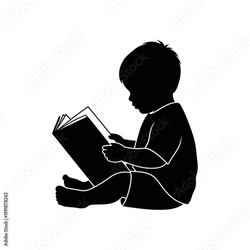 Silhouette of child reading book.