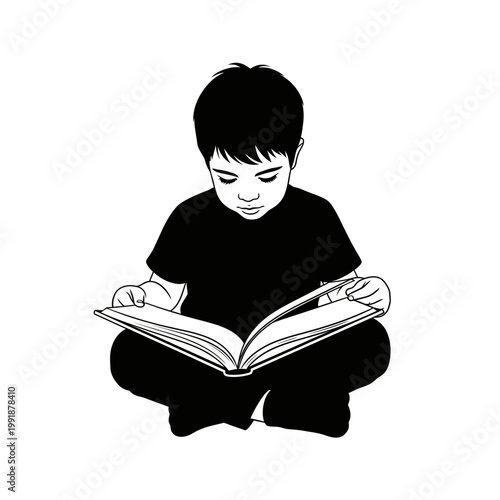 Young boy reading a book.