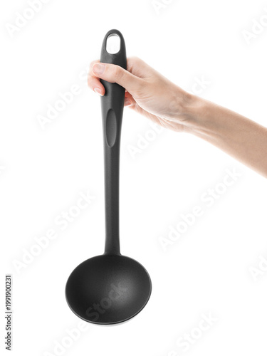 Ladle, spatula, kitchen utensils, in hand isolated on white background. Kitchen spatula on an isolated white background. Black plastic kitchen spatula. Kitchen utensil set.