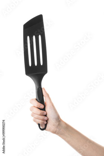 Ladle, spatula, kitchen utensils, in hand isolated on white background. Kitchen spatula on an isolated white background. Black plastic kitchen spatula. Kitchen utensil set.