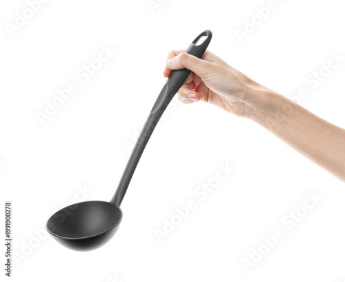 Ladle, spatula, kitchen utensils, in hand isolated on white background. Kitchen spatula on an isolated white background. Black plastic kitchen spatula. Kitchen utensil set.