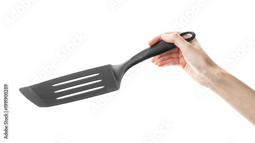 Ladle, spatula, kitchen utensils, in hand isolated on white background. Kitchen spatula on an isolated white background. Black plastic kitchen spatula. Kitchen utensil set.