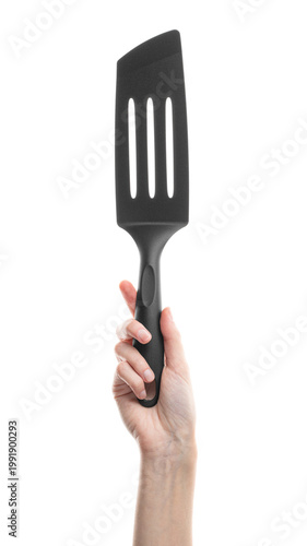 Ladle, spatula, kitchen utensils, in hand isolated on white background. Kitchen spatula on an isolated white background. Black plastic kitchen spatula. Kitchen utensil set.