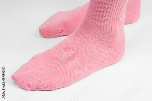A cozy and comfortable photo of women's feet in soft socks. Colorful cotton socks.