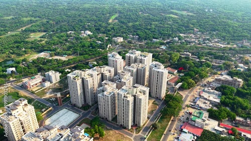 Modern high-rise residential complex in a sprawling urban landscape.