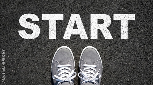 Starting point with sneakers on asphalt road