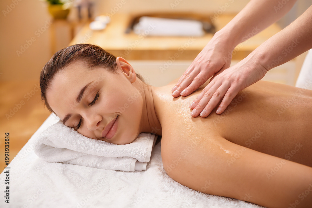 Fototapeta premium Relaxation through soothing massage in a tranquil spa environment