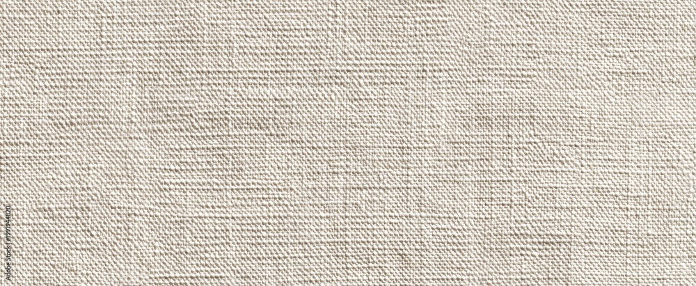 Fototapeta premium Close-up of a textured, woven, light beige fabric with a matte finish