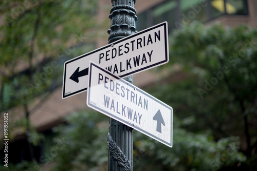Metal Signposts With Arrows Direct Pedestrians Through City Pathways Clearly new york