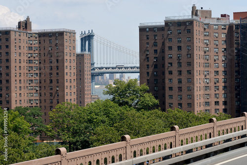 Cityscape With River In Background. Morning Scene Of City With Bridge And River new york