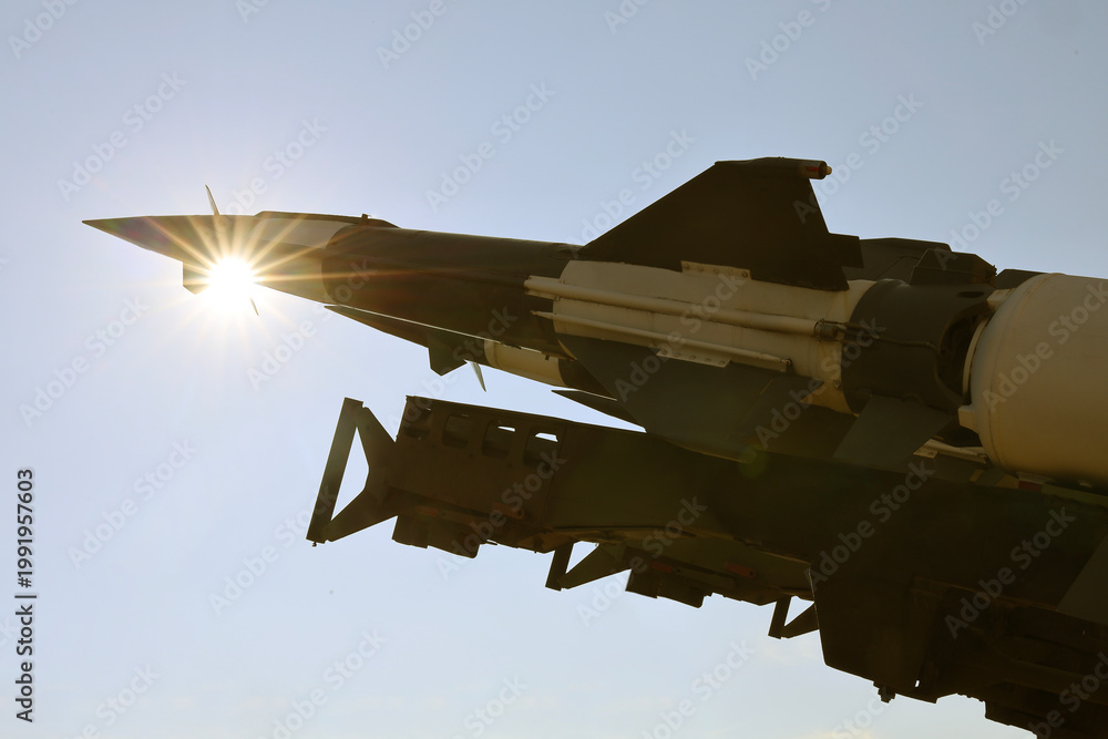 Naklejka premium sunrays sky background. weapons, military air defence complex. missile. atomic nuclear ballistic rocket with one rocket cruise missiles