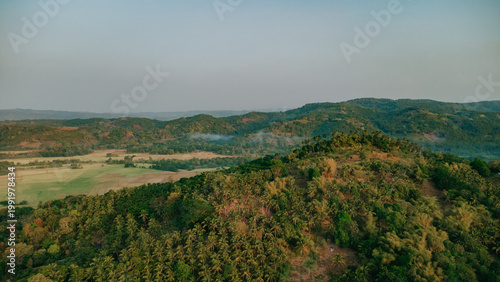 Aerial View of Siniloan, Laguna, Rural Landscape, Tropical Mountains with Lush Green Forests and Rice Fields, Sierra Madre Foothills in Philippines Scenery