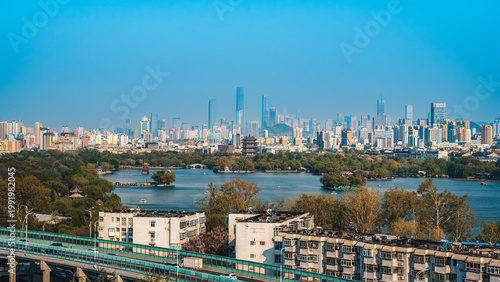 Urban Lake with City Skyline in Clear Blue Sky