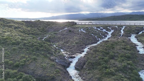 Panoramic aerial view of a large dam and water reservoir in San Luis, Argentina.