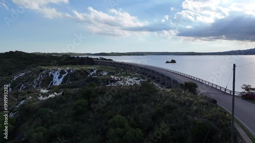 Panoramic aerial view of a large dam and water reservoir in San Luis, Argentina.