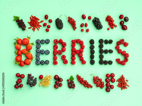 the word BERRIES from ingredients strawberries, blueberries, raspberries, blackberries, and cranberries. Others include mulberries, acai, goji berries, currants, and lingonberries on a mint background