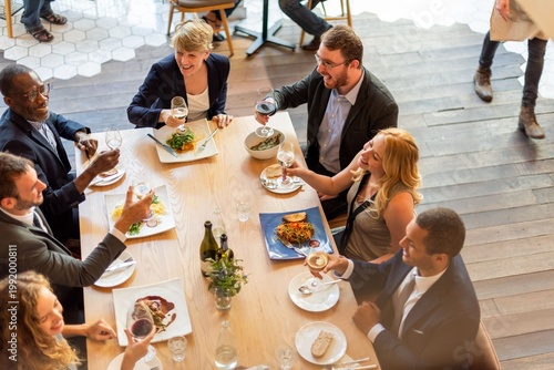 Konstfotografi Diverse group enjoying dinner photo