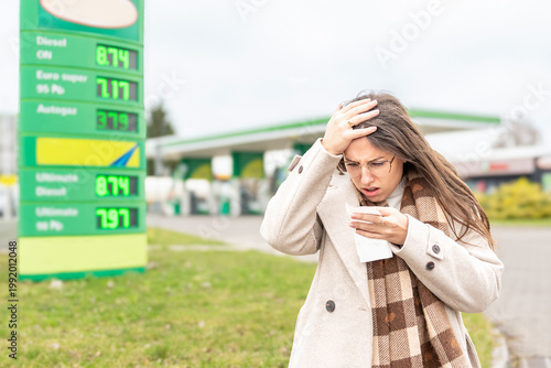 Fuel inflation concept woman shocked by gas receipt