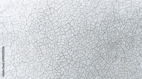 Detailed texture of white cracked paint on a flat surface as abstract background
