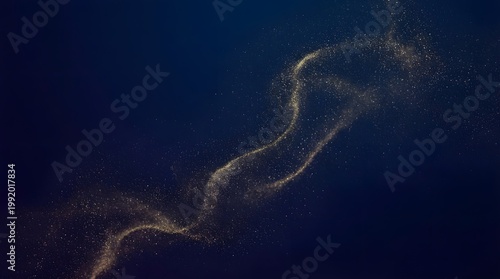 Abstract swirling wave of golden particles against a dark blue background creating a cosmic or ethereal effect